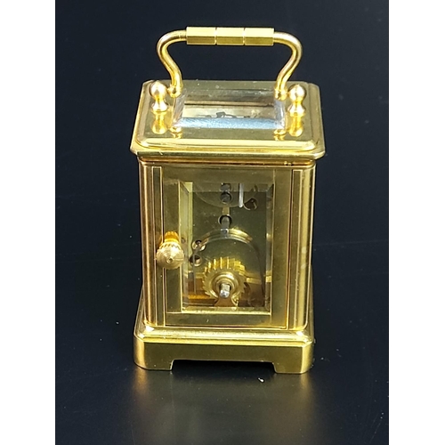 233 - Miniature brass carriage clock with enamelled dial