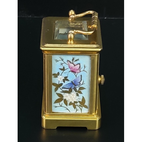 251 - Miniature carriage clock with porcelain panels and enamelled dial