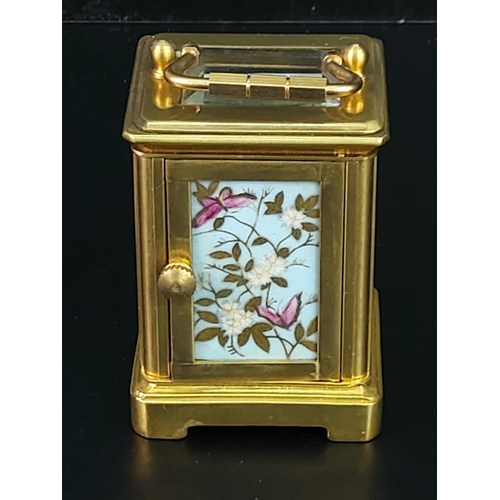 251 - Miniature carriage clock with porcelain panels and enamelled dial