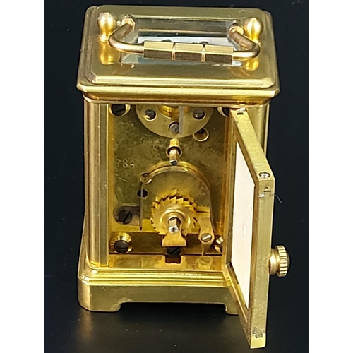 251 - Miniature carriage clock with porcelain panels and enamelled dial