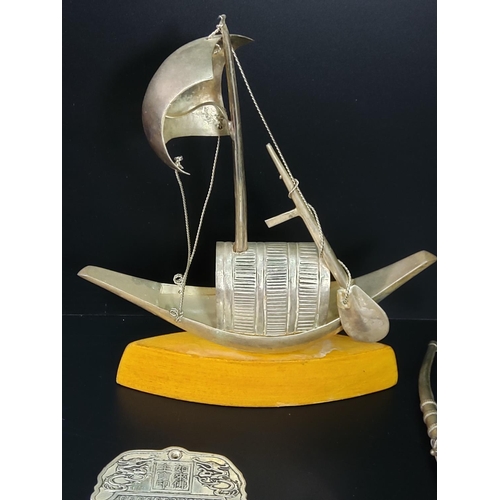 273 - Opium pipe, model ship and ingot