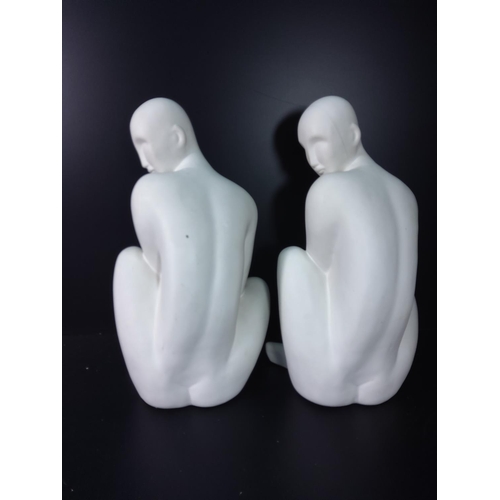 146 - 2 figures of seated men