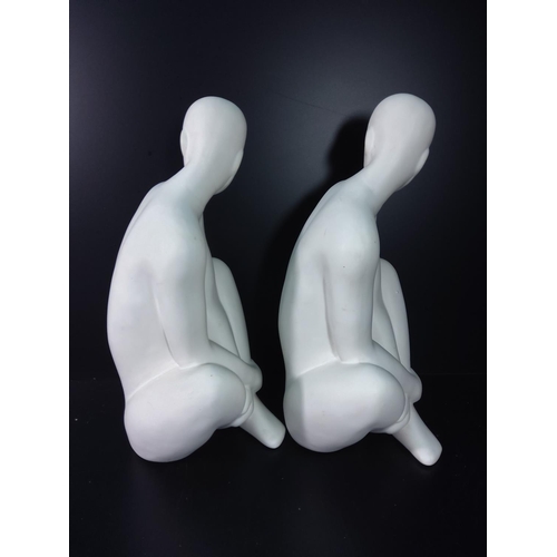 146 - 2 figures of seated men