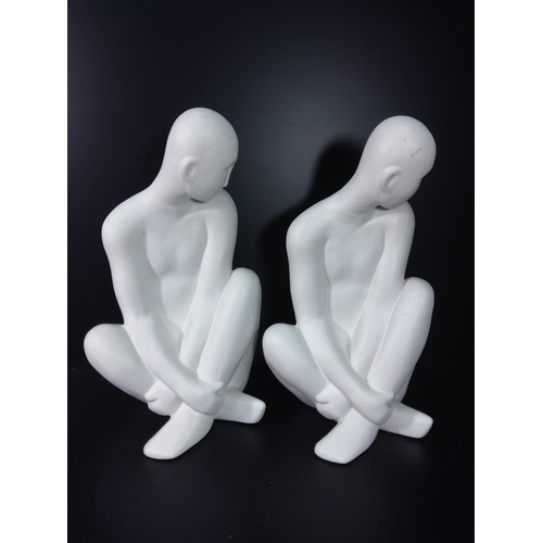 146 - 2 figures of seated men