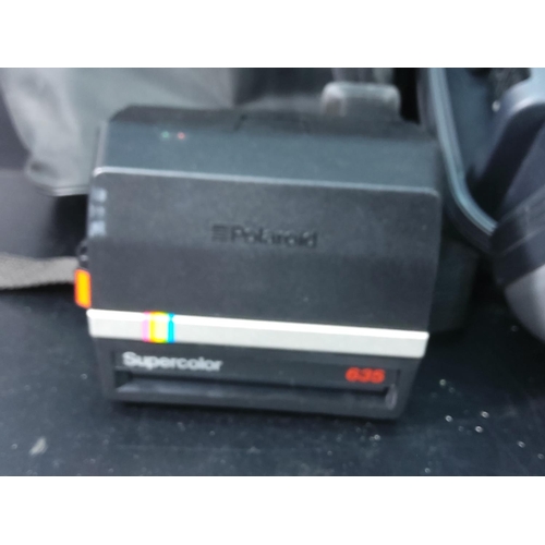 148 - Camcorder and polaroid camera