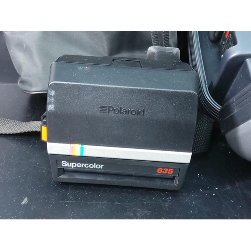 148 - Camcorder and polaroid camera