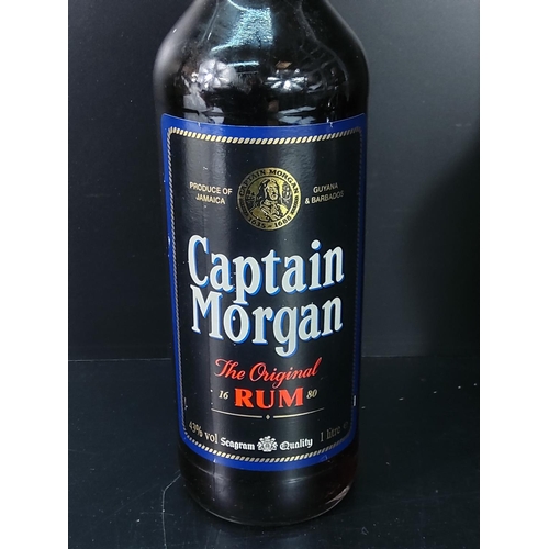 183 - Bottle of Kirsh and Captain Morgan Rum