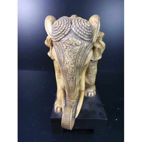 98 - Modern elephant figure on black base, 32 x 28cms