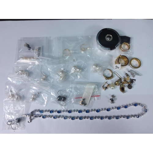 386 - Box of earrings, rings and a necklace