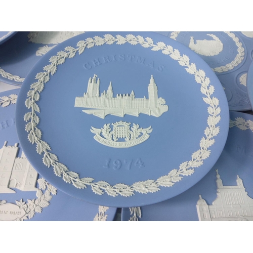 119 - 16 Wedgwood Jasperware year plates and a Jasperware bowl