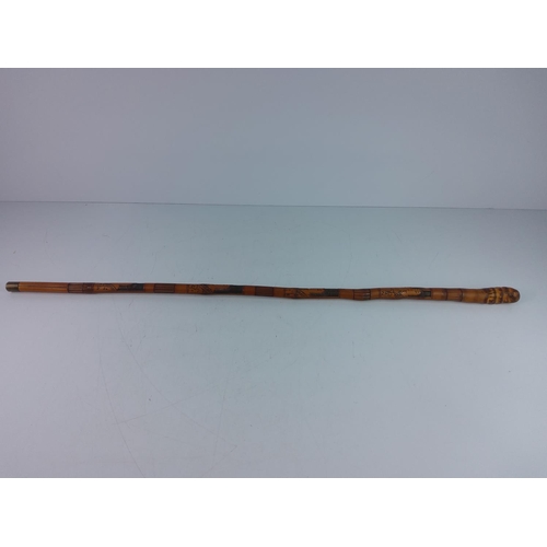 183 - Antique carved oriental bamboo walking cane with Geisha carvings and brass tip