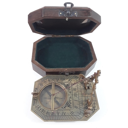 384 - Wooden cased brass compass