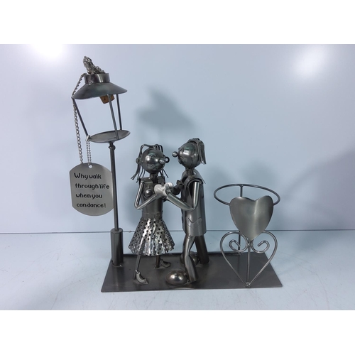 37 - 3 novelty metal wine holders and a nuts and bolts horse and jockey