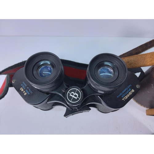 114 - A pair of Lieberman & Gortz binoculars and a pair of Bushnell Sportsview binoculars