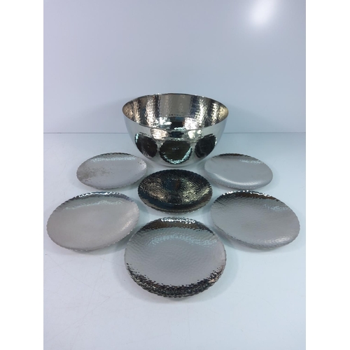 141 - Metal bowl and saucers