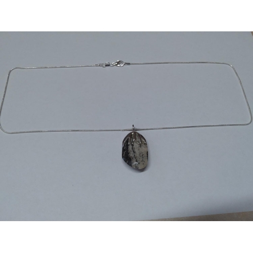 211 - Stone set silver pendant on chain