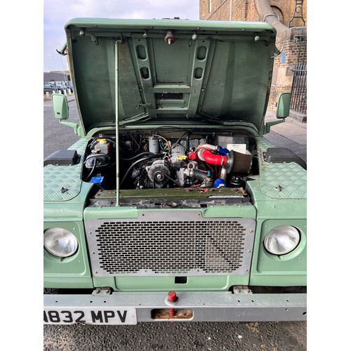 28 - 1995 Land Rover Defender 110  ex Military with canvas roof, with Heritage external colours. Having u... 