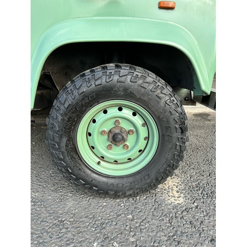 28 - 1995 Land Rover Defender 110  ex Military with canvas roof, with Heritage external colours. Having u... 