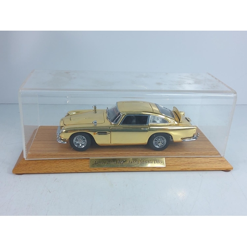 197 - Boxed cased collectors James Bond gold plated Astin Martin DB5