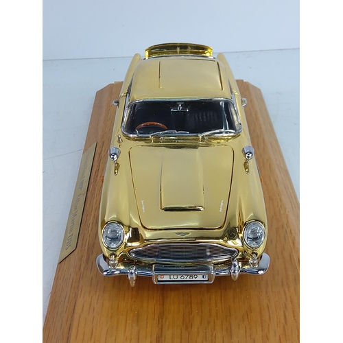 197 - Boxed cased collectors James Bond gold plated Astin Martin DB5