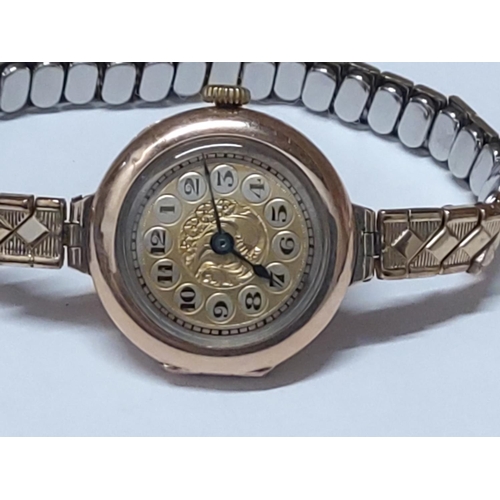 223 - 9ct gold cased watch