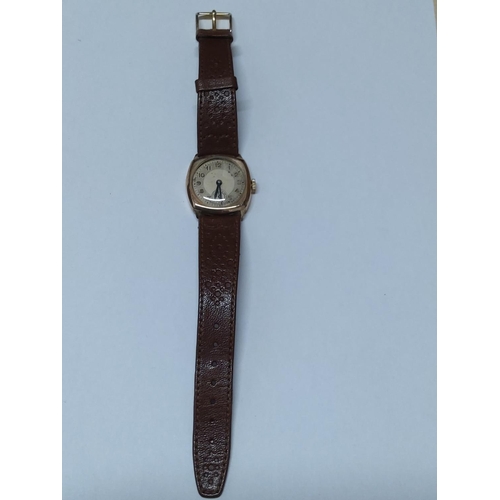 224 - 9ct gold cased watch with leather strap