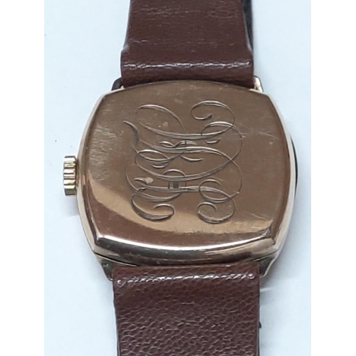 224 - 9ct gold cased watch with leather strap