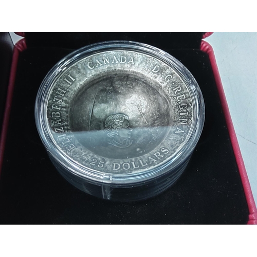 227 - Cased Canadian silver Centenary coin modelled into a crucible