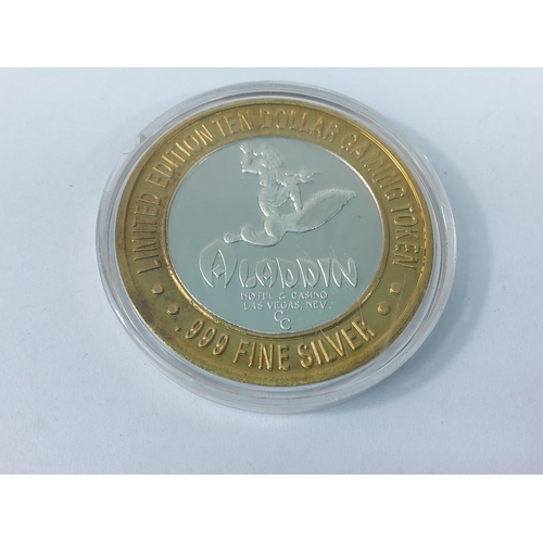 273 - Cased Limited Edition Aladdin ten dollar gaming token with the centre being 999 fine silver