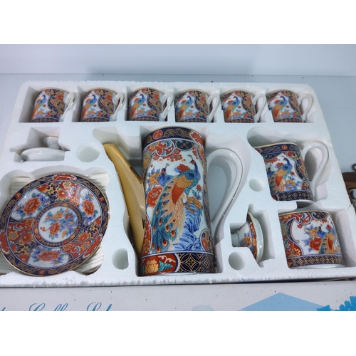 129 - Boxed oriental coffee set and thimbles and wooden jewellery box