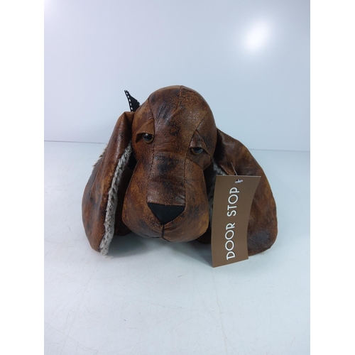 141 - Novelty faux leather dog doorstop