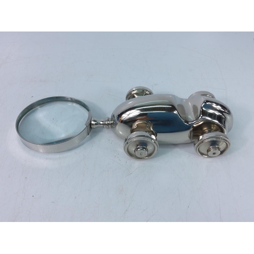 74 - Novelty racing car magnifying glass