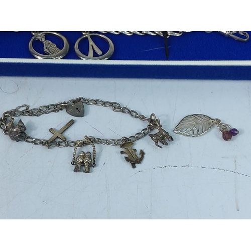 254 - Silver charm bracelet and a silver pendant, gross weight 13.5g and boxed Limited Edition silver Avon... 