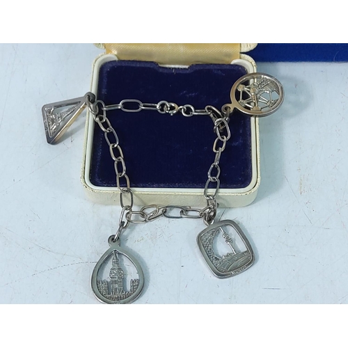 254 - Silver charm bracelet and a silver pendant, gross weight 13.5g and boxed Limited Edition silver Avon... 