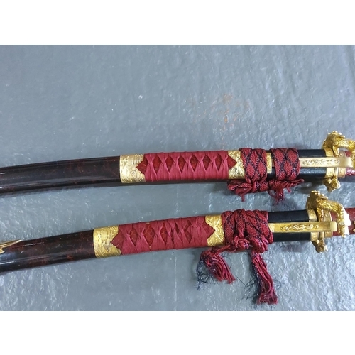 154 - Graduated pair of Samurai swords