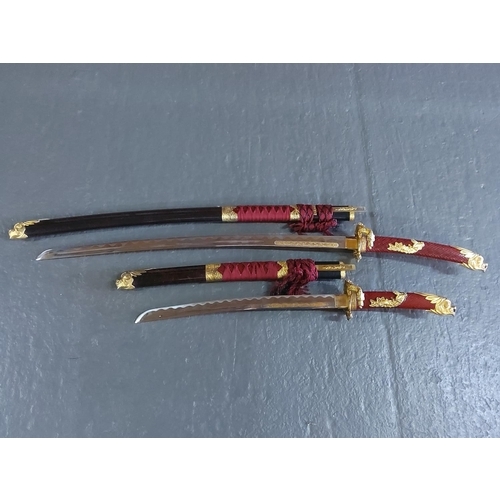 154 - Graduated pair of Samurai swords