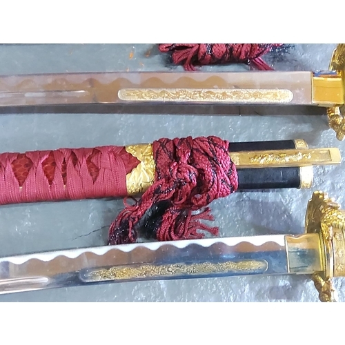 154 - Graduated pair of Samurai swords