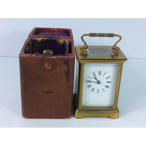 310 - Vintage cased brass carraige clock with key