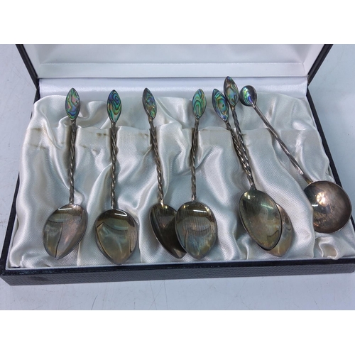 403 - Cased set of 6 silver and shell spoons plus one other silver and shell spoon, gross weight 31.6g