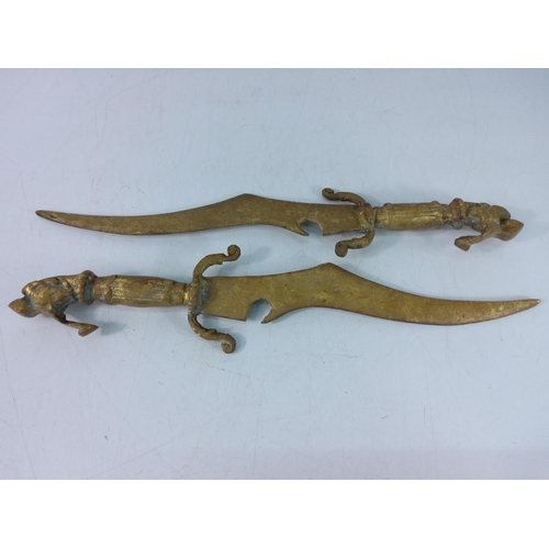 449 - Cast brass decorative short swords