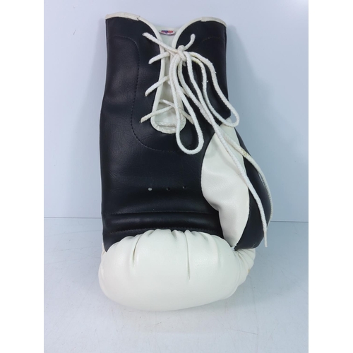 180 - A collectors edition Lennox Lewis and Mike Tyson boxing glove with no certificate