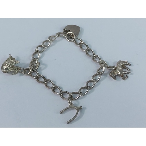 355 - Silver brooch and silver charm bracelet, 26.6g gross