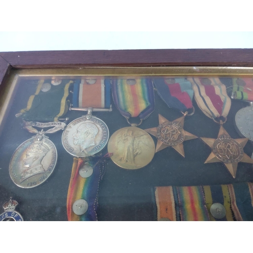 426 - Cased medals, badges, miniatures and a photograph