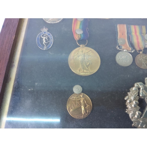 426 - Cased medals, badges, miniatures and a photograph