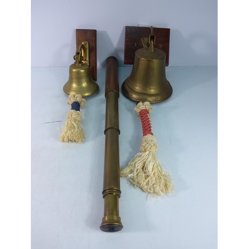 73 - 2 brass bells with pulls and a leather bound telescope