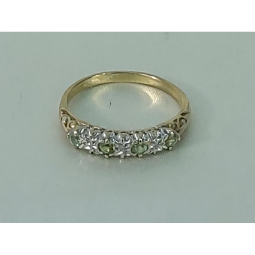 211 - 9ct gold peridot and diamond half hoop ring, size T