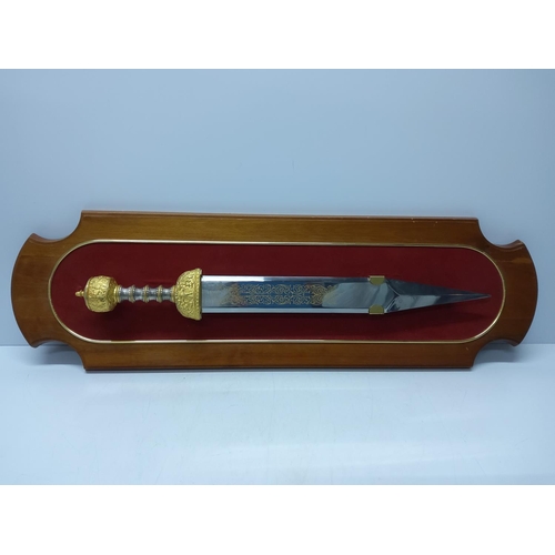 120 - Wooden Mounted Franklin Mint Roman short sword, approx 92cms