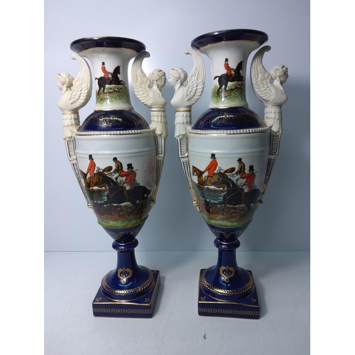 133 - Pair of tall porcelain vases with hunt scenes, height 48cms