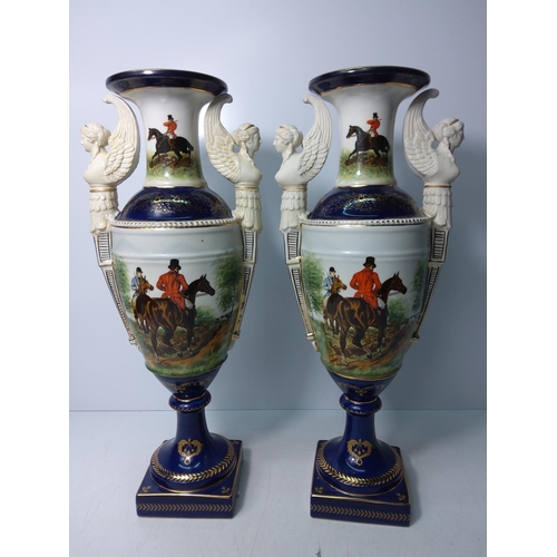 133 - Pair of tall porcelain vases with hunt scenes, height 48cms