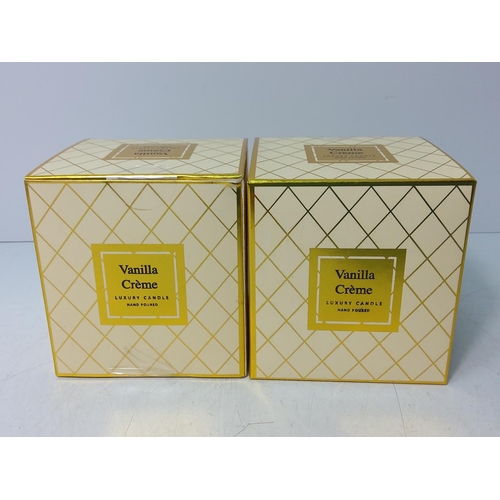 154 - 2 boxed vanilla creme candles